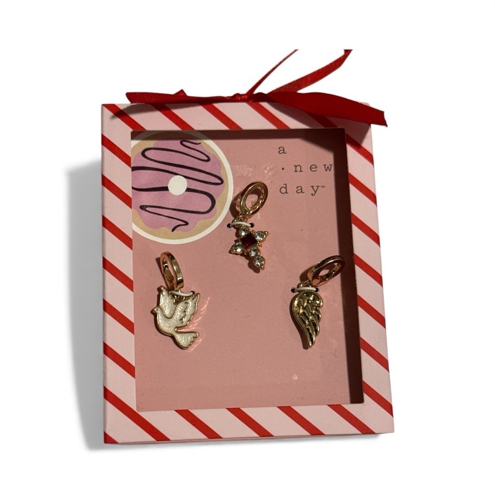 A new day 3 pack gold tone charms white dove small cross and a wing New